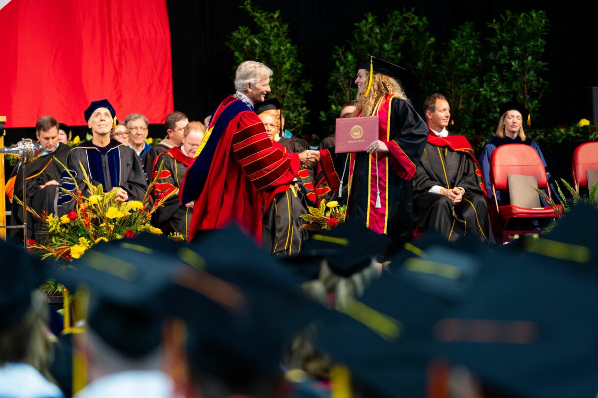 University of Denver commencement--Jeremey Haefner with graduates