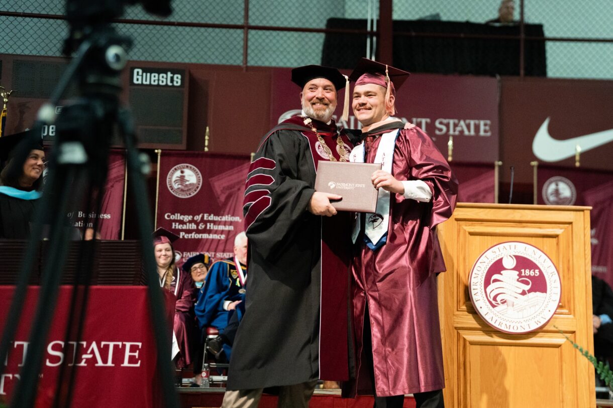 michael davis with student at fairmont state commencement